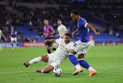 300925 - Cardiff City v Burton Albion, EFL Sky Bet League 1 - Chris Willock of Cardiff City is challenged by Kyran Lofthouse of Burton Albion