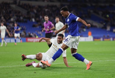 300925 - Cardiff City v Burton Albion, EFL Sky Bet League 1 - Chris Willock of Cardiff City is challenged by Kyran Lofthouse of Burton Albion