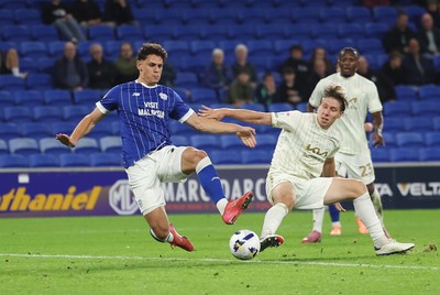 300925 - Cardiff City v Burton Albion, EFL Sky Bet League 1 - Yousef Salech of Cardiff City beats Alex Hartridge of Burton Albion as he shoots at goal
