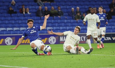 300925 - Cardiff City v Burton Albion, EFL Sky Bet League 1 - Yousef Salech of Cardiff City beats Alex Hartridge of Burton Albion as he shoots at goal