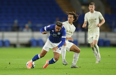 300925 - Cardiff City v Burton Albion, EFL Sky Bet League 1 - Callum Robinson of Cardiff City is tackled by Charlie Webster of Burton Albion