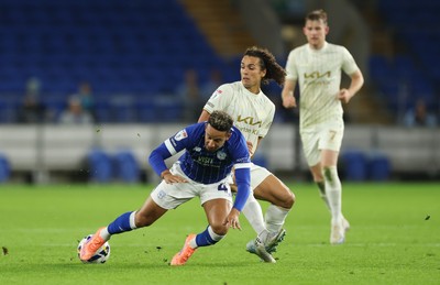300925 - Cardiff City v Burton Albion, EFL Sky Bet League 1 - Callum Robinson of Cardiff City is tackled by Charlie Webster of Burton Albion