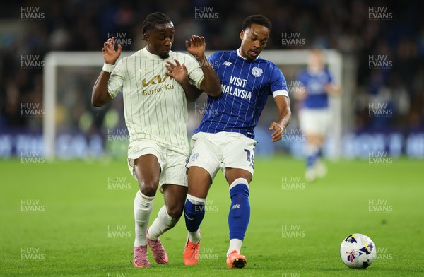 300925 - Cardiff City v Burton Albion, EFL Sky Bet League 1 - Chris Willock of Cardiff City holds off Sebastian Revan of Burton Albion