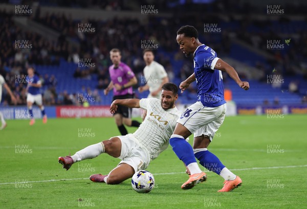 300925 - Cardiff City v Burton Albion, EFL Sky Bet League 1 - Chris Willock of Cardiff City is challenged by Kyran Lofthouse of Burton Albion