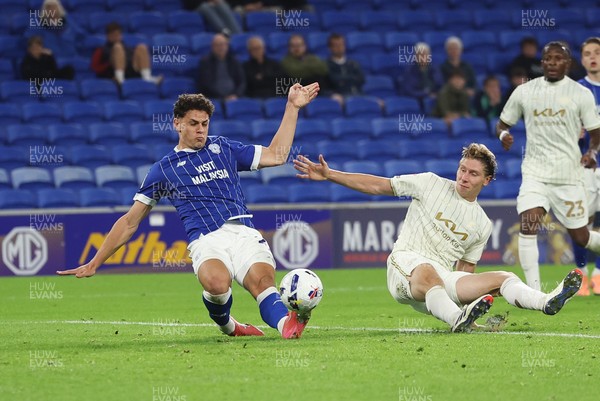 300925 - Cardiff City v Burton Albion, EFL Sky Bet League 1 - Yousef Salech of Cardiff City beats Alex Hartridge of Burton Albion as he shoots at goal
