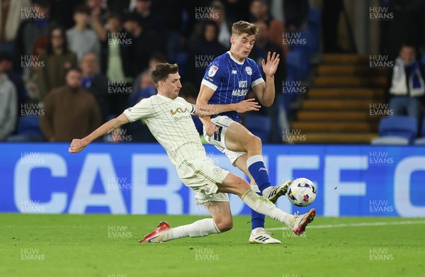 300925 - Cardiff City v Burton Albion, EFL Sky Bet League 1 - Dylan Lawlor of Cardiff City and Jake Beesley of Burton Albion compete for the ball
