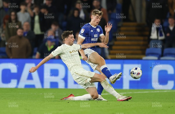300925 - Cardiff City v Burton Albion, EFL Sky Bet League 1 - Dylan Lawlor of Cardiff City and Jake Beesley of Burton Albion compete for the ball
