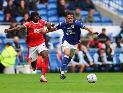 190926 Cardiff City v Charlton Athletic, EFL Sky Bet Championship - Perry Ng of Cardiff City holds off Tyreece Campbell of Charlton Athletic