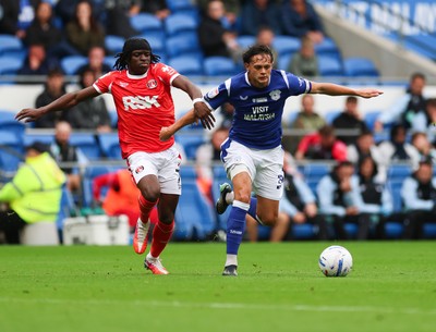 190926 Cardiff City v Charlton Athletic, EFL Sky Bet Championship - Perry Ng of Cardiff City holds off Tyreece Campbell of Charlton Athletic