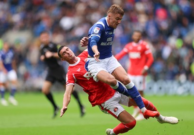 190926 Cardiff City v Charlton Athletic, EFL Sky Bet Championship - Joel Bagan of Cardiff City is tackled by Lloyd Jones of Charlton Athletic