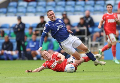 190926 Cardiff City v Charlton Athletic, EFL Sky Bet Championship - Jack Moylan of Cardiff City is brought down by Oliver Skipp of Charlton Athletic