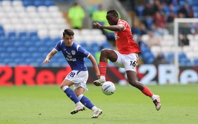 190926 Cardiff City v Charlton Athletic, EFL Sky Bet Championship - Timothy Ouma of Charlton Athletic wins the ball from Alex Robertson of Cardiff City