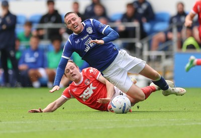190926 Cardiff City v Charlton Athletic, EFL Sky Bet Championship - Jack Moylan of Cardiff City is brought down by Oliver Skipp of Charlton Athletic
