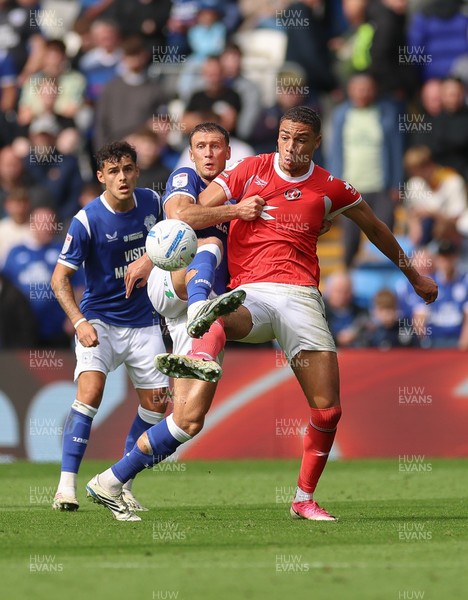 190926 Cardiff City v Charlton Athletic, EFL Sky Bet Championship - Krystian Bielik of Cardiff City and Miles Leaburn of Charlton Athletic compete for the ball