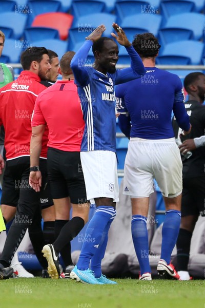 300620 - Cardiff City v Charlton Athletic - SkyBet Championship - Albert Adomah of Cardiff City waves to the empty stands and does the ayatollah as he walks off the field at full time