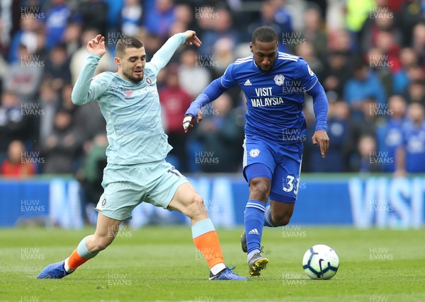 310319 - Cardiff City v Chelsea, Premier League - Mateo Kovacic of Chelsea and Junior Hoilett of Cardiff City compete for the ball
