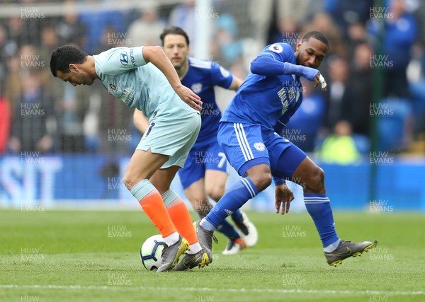 310319 - Cardiff City v Chelsea, Premier League - Pedro of Chelsea and Junior Hoilett of Cardiff City compete for the ball