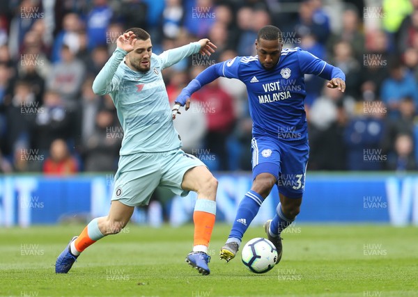310319 - Cardiff City v Chelsea, Premier League - Mateo Kovacic of Chelsea and Junior Hoilett of Cardiff City compete for the ball