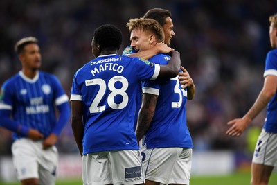 260825 - Cardiff City v Cheltenham Town - Carabao Cup Round Two - Isaak Davies of Cardiff City celebrates scoring a goal with team mates