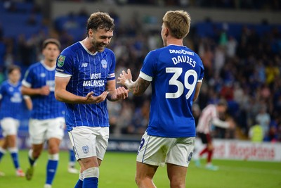260825 - Cardiff City v Cheltenham Town - Carabao Cup Round Two - Calum Chambers of Cardiff City celebrates scoring a goal with team mates
