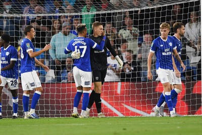 260825 - Cardiff City v Cheltenham Town - Carabao Cup Round Two - Matthew Turner of Cardiff City saves the penalty effort from Lee Angol of Cheltenham Town