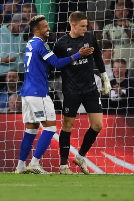 260825 - Cardiff City v Cheltenham Town - Carabao Cup Round Two - Matthew Turner of Cardiff City saves the penalty effort from Lee Angol of Cheltenham Town