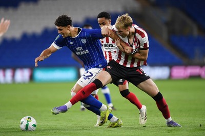260825 - Cardiff City v Cheltenham Town - Carabao Cup Round Two - Yousef Salech of Cardiff City is challenged by Jokubas Mazionis of Cheltenham Town