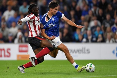 260825 - Cardiff City v Cheltenham Town - Carabao Cup Round Two - Rubin Colwill of Cardiff City has a shot on goal saved  by Joe Day of Cheltenham Town