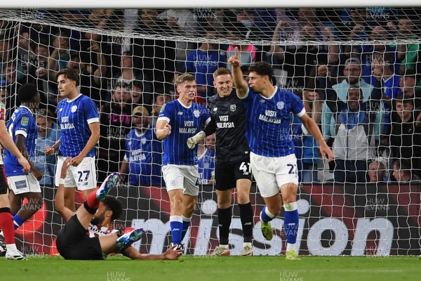260825 - Cardiff City v Cheltenham Town - Carabao Cup Round Two - Matthew Turner of Cardiff City saves the penalty effort from Lee Angol of Cheltenham Town