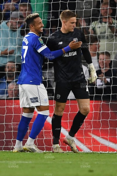 260825 - Cardiff City v Cheltenham Town - Carabao Cup Round Two - Matthew Turner of Cardiff City saves the penalty effort from Lee Angol of Cheltenham Town
