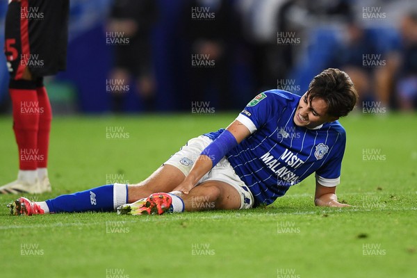 260825 - Cardiff City v Cheltenham Town - Carabao Cup Round Two - Joel Colwill of Cardiff City is challenged by Jokubas Mazionis of Cheltenham Town