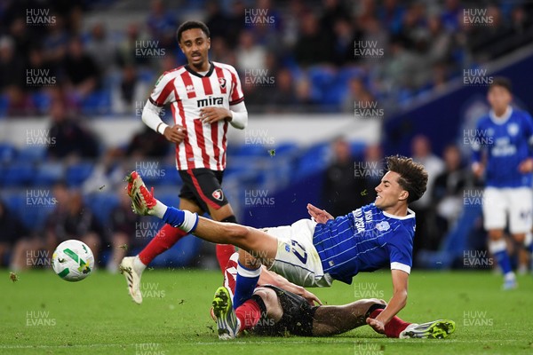 260825 - Cardiff City v Cheltenham Town - Carabao Cup Round Two - Joel Colwill of Cardiff City is challenged by Jokubas Mazionis of Cheltenham Town