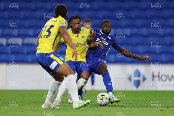 090823 - Cardiff City v Colchester United, EFL Carabao Cup - Jamilu Collins of Cardiff City is forced off the ball by Mauro Bandeira of Colchester United