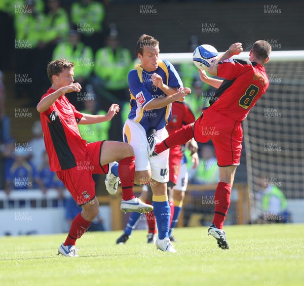 25.08.07 - Cardiff City v Coventry City, Coca Cola Championship -  Cardiff's Gavin Rae feels the force of Coventry's Michael Doyle's challenge 