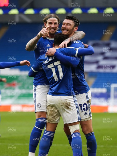 130221 - Cardiff City v Coventry City, Sky Bet Championship - Kieffer Moore of Cardiff City celebrate with Aden Flint of Cardiff City and Josh Murphy of Cardiff City after he scores the second goal
