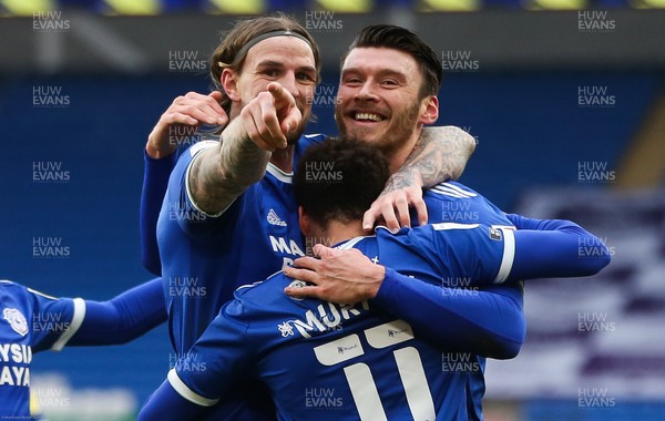130221 - Cardiff City v Coventry City, Sky Bet Championship - Kieffer Moore of Cardiff City celebrate with Aden Flint of Cardiff City and Josh Murphy of Cardiff City after he scores the second goal
