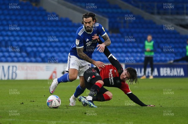 130221 - Cardiff City v Coventry City, Sky Bet Championship - Marlon Pack of Cardiff City and Callum O'Hare of Coventry City compete for the ball