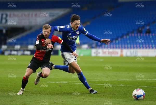 130221 - Cardiff City v Coventry City, Sky Bet Championship - Perry Ng of Cardiff City is challenged for the ball by Jamie Allen of Coventry City