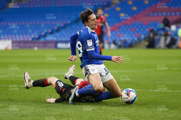 130221 - Cardiff City v Coventry City, Sky Bet Championship - Perry Ng of Cardiff City is challenged for the ball by Jamie Allen of Coventry City