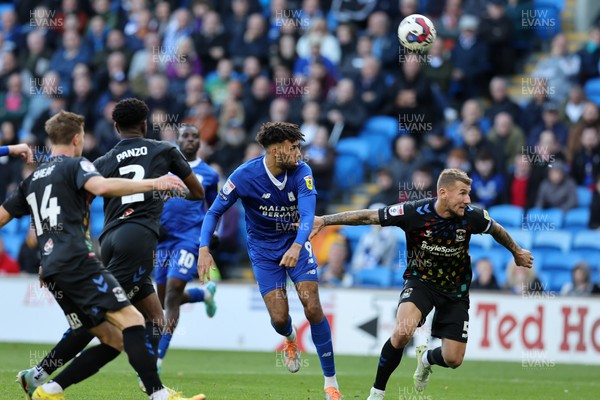 151022 - Cardiff City v Coventry City - Sky Bet Championship - Kion Etete of Cardiff city (c) attempts a header at goal 
