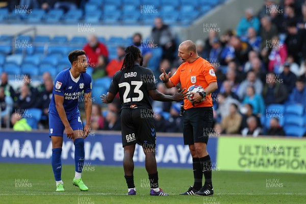 151022 - Cardiff City v Coventry City - Sky Bet Championship - Referee Robert Madley speaks with Fankaty Dabo of Coventry city and Callum Robinson of Cardiff city 