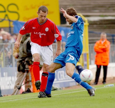 270903 Cardiff City v Crewe Alexandra Crewe's Kenny Lunt passes around Mark Bonner 