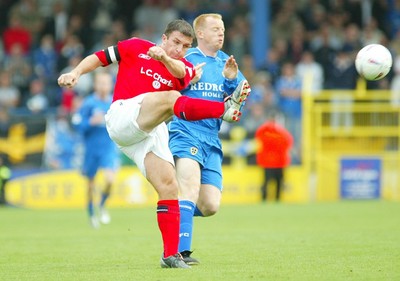 270903Cardiff City v Crewe Alexandra  Crewe's David Brammar clears as Andy Campbell closes in  