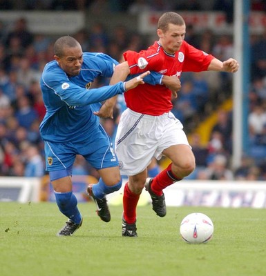 270903 Cardiff City v Crewe Alexandra Crewe's Kenny Lunt sees off a challenge from Danny Gabidon 