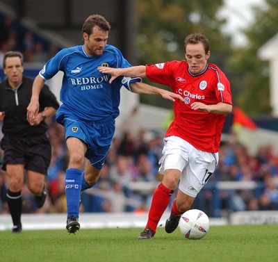 270903 Cardiff City v Crewe Alexandra Crewe's David Vaughan gets past Mark Bonner 