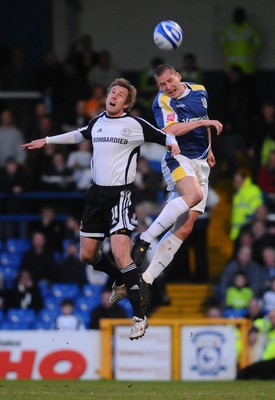 08.04.09 - Championship Football Cardiff City v Derby County Derby's Rob Hulse and Cardiff's Gabor Gyepes go for a high ball 