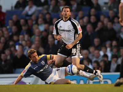 08.04.09.. Cardiff City v Derby County, Coca Cola Championship. -   Derby's Mile Sterjovski is brought down by Cardiff's Stephen McPhail 