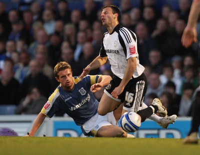 08.04.09.. Cardiff City v Derby County, Coca Cola Championship. -   Derby's Mile Sterjovski is brought down by Cardiff's Stephen McPhail 