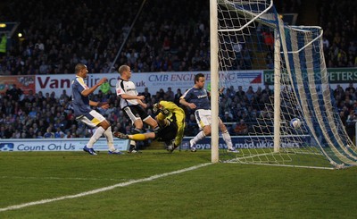 08.04.09.. Cardiff City v Derby County, Coca Cola Championship. -   Cardiff's Jay Bothroyd (lt) and Gavin Rae look on as Roger Johnson attempt at goal beats Derby's keeper Stephen Bywater to score 
