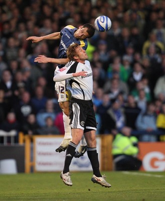 08.04.09.. Cardiff City v Derby County, Coca Cola Championship. -   Cardiff's Roger Johnson gets above Derby's Rob Hulse  